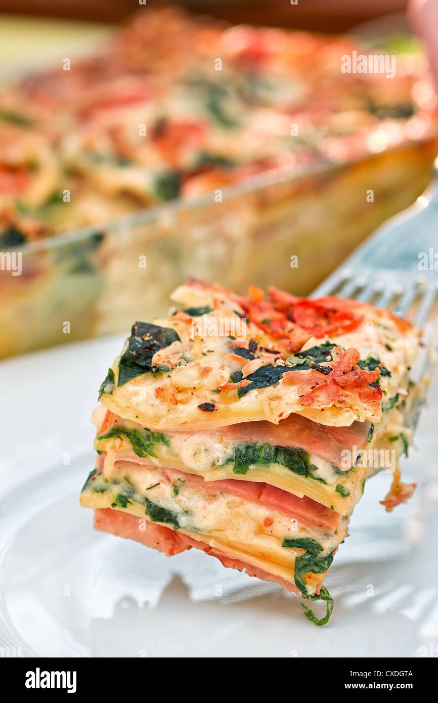 Piece of lasagna on the fork Stock Photo