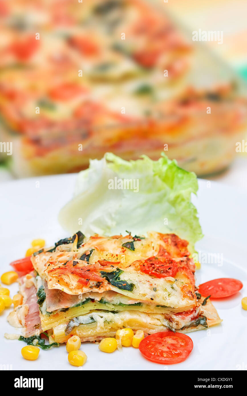 Piece of lasagna on the fork Stock Photo