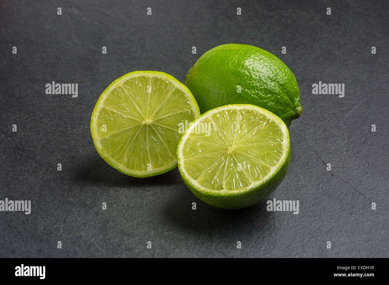 limes on slate plate Stock Photo