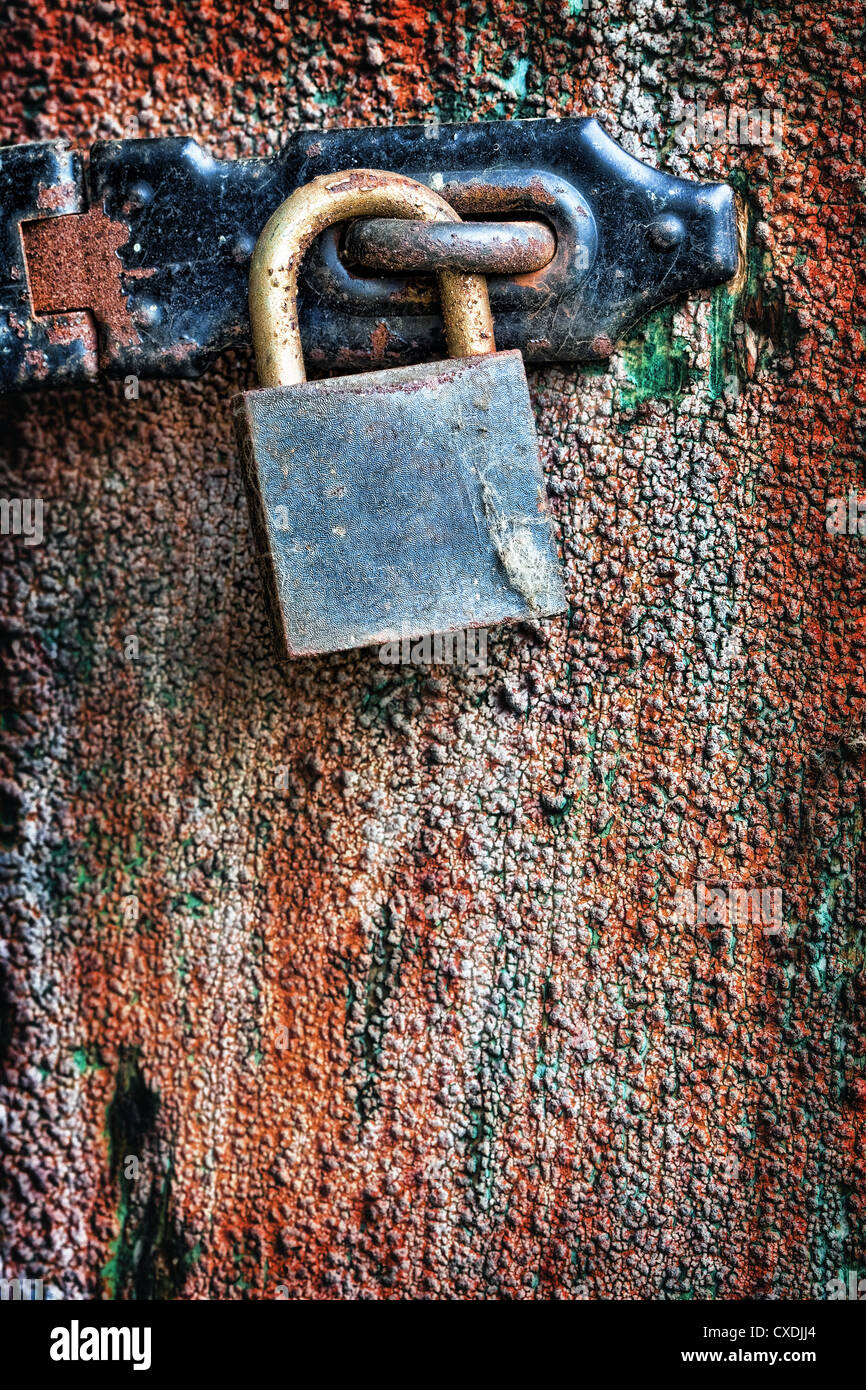 Old rusty padlock hanging on the door Stock Photo - Alamy