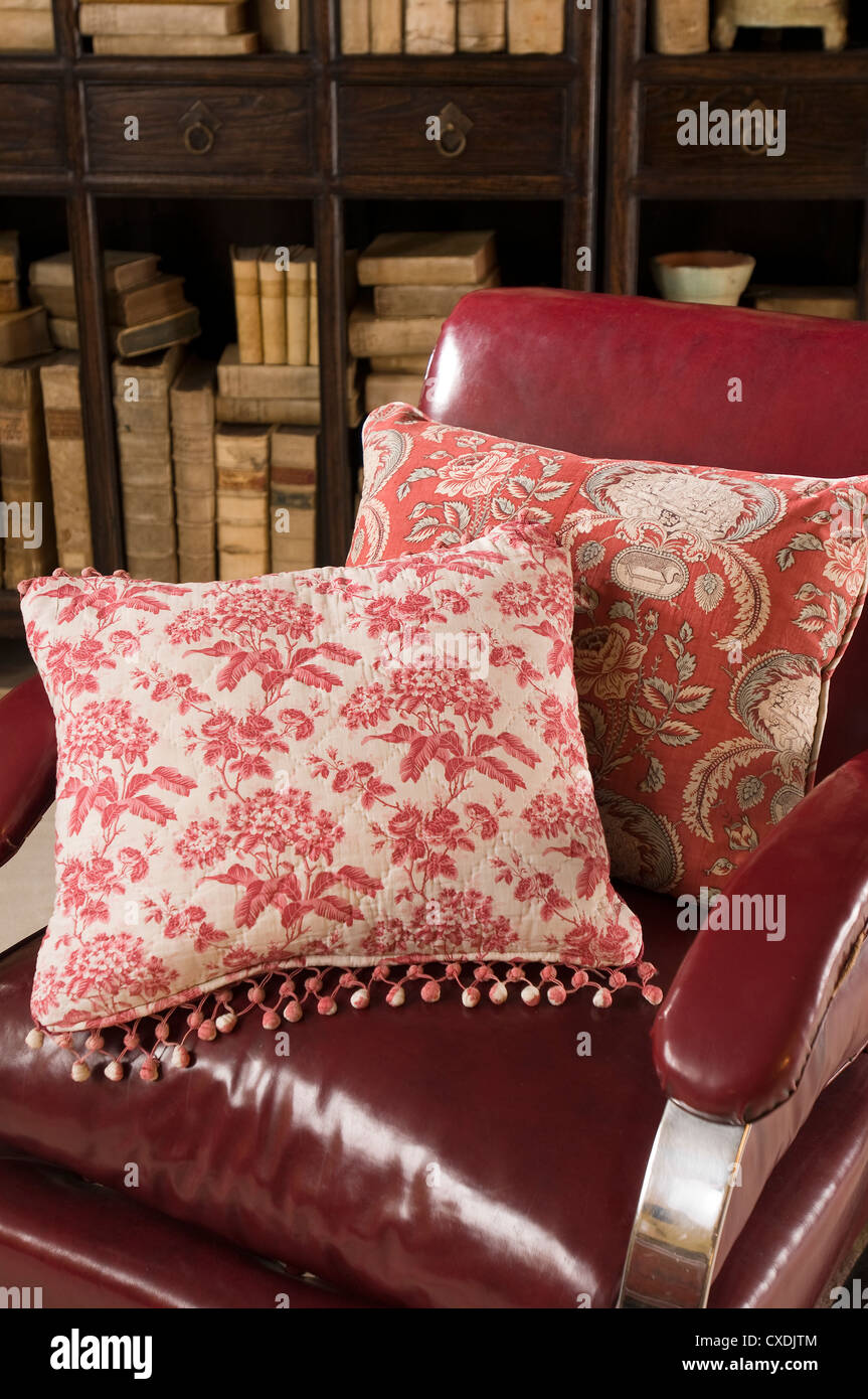 American armchair with cushion made from quilted Toile de Jouy and French block printed cotton Stock Photo