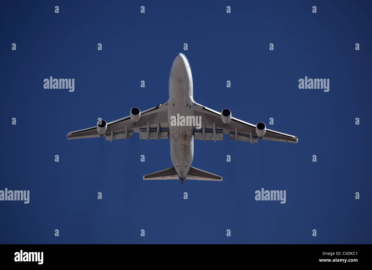 Airplane flying in the sky Stock Photo - Alamy