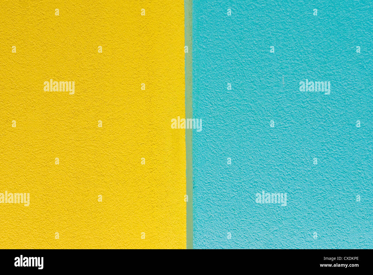 Wall of blue and yellow textured paint Stock Photo