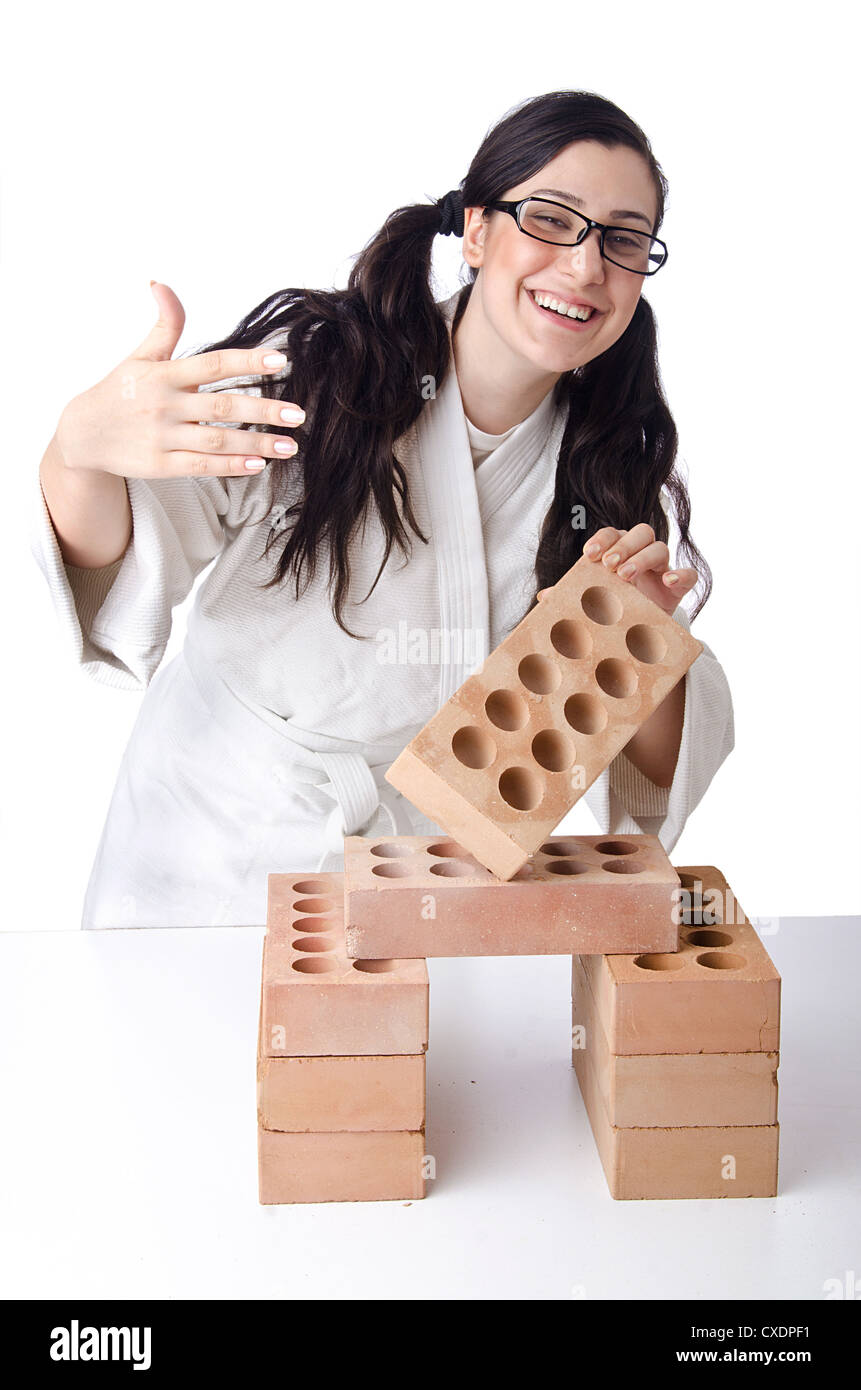 Woman karate breaking bricks on white Stock Photo Alamy