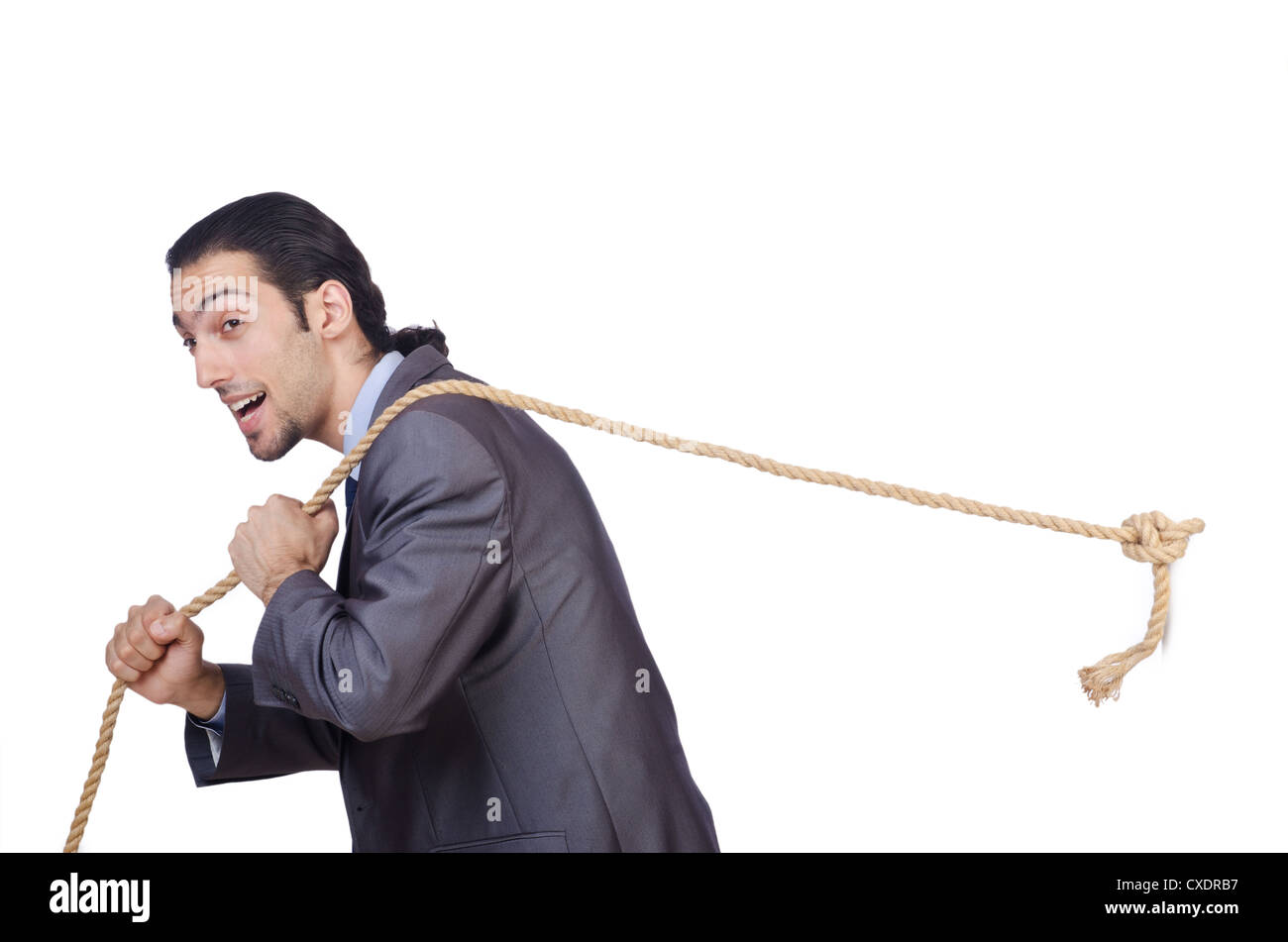 Businessman pulling rope on white Stock Photo - Alamy