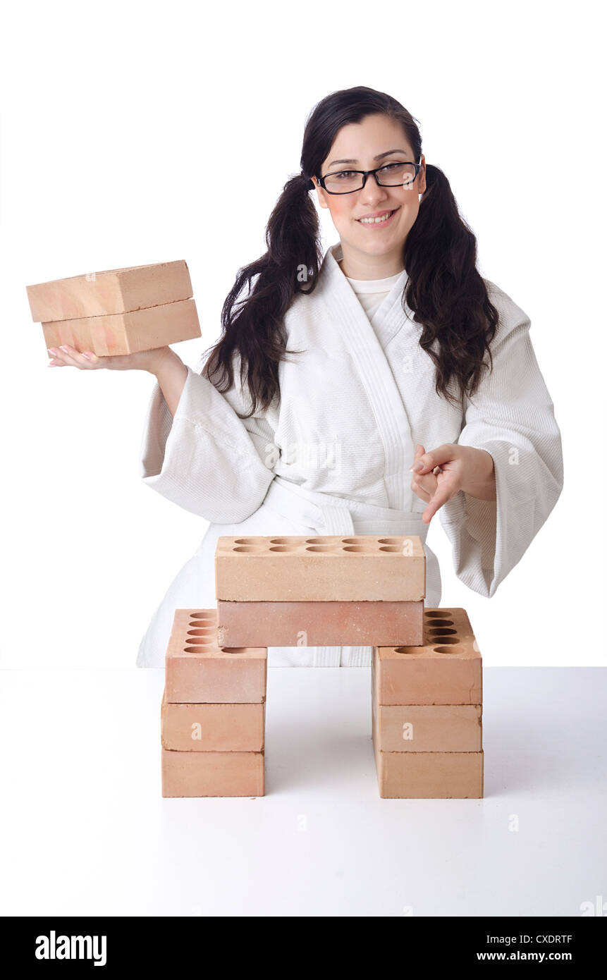 Woman karate breaking bricks on white Stock Photo Alamy