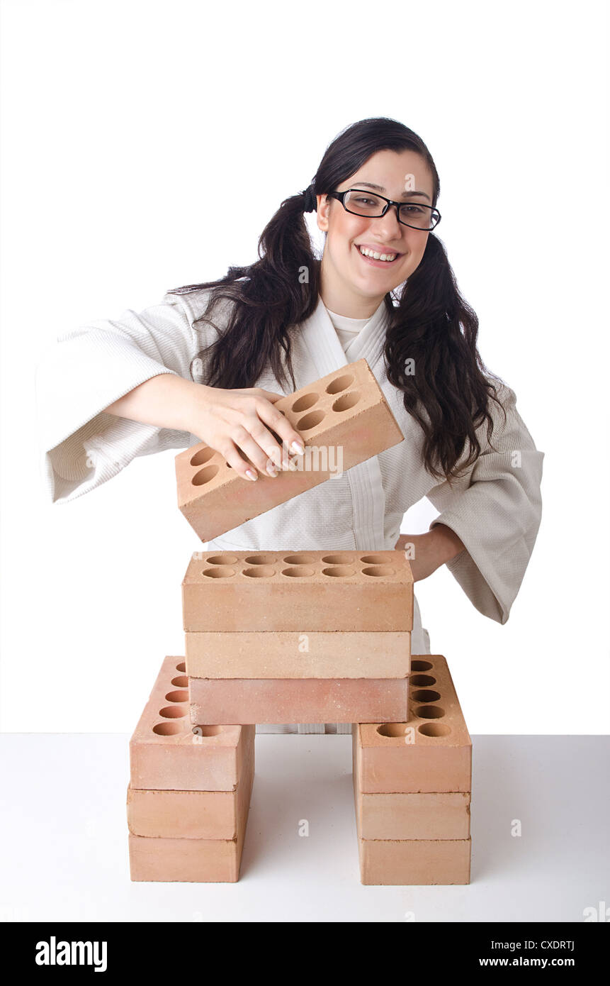 Woman karate breaking bricks on white Stock Photo Alamy