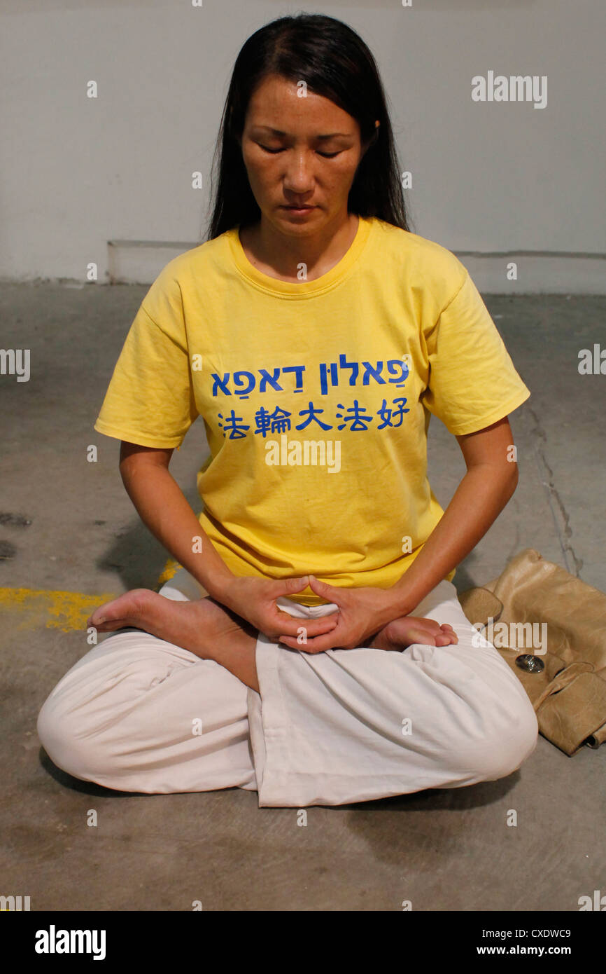Chinese woman practicing Falun Gong in Israel Stock Photo