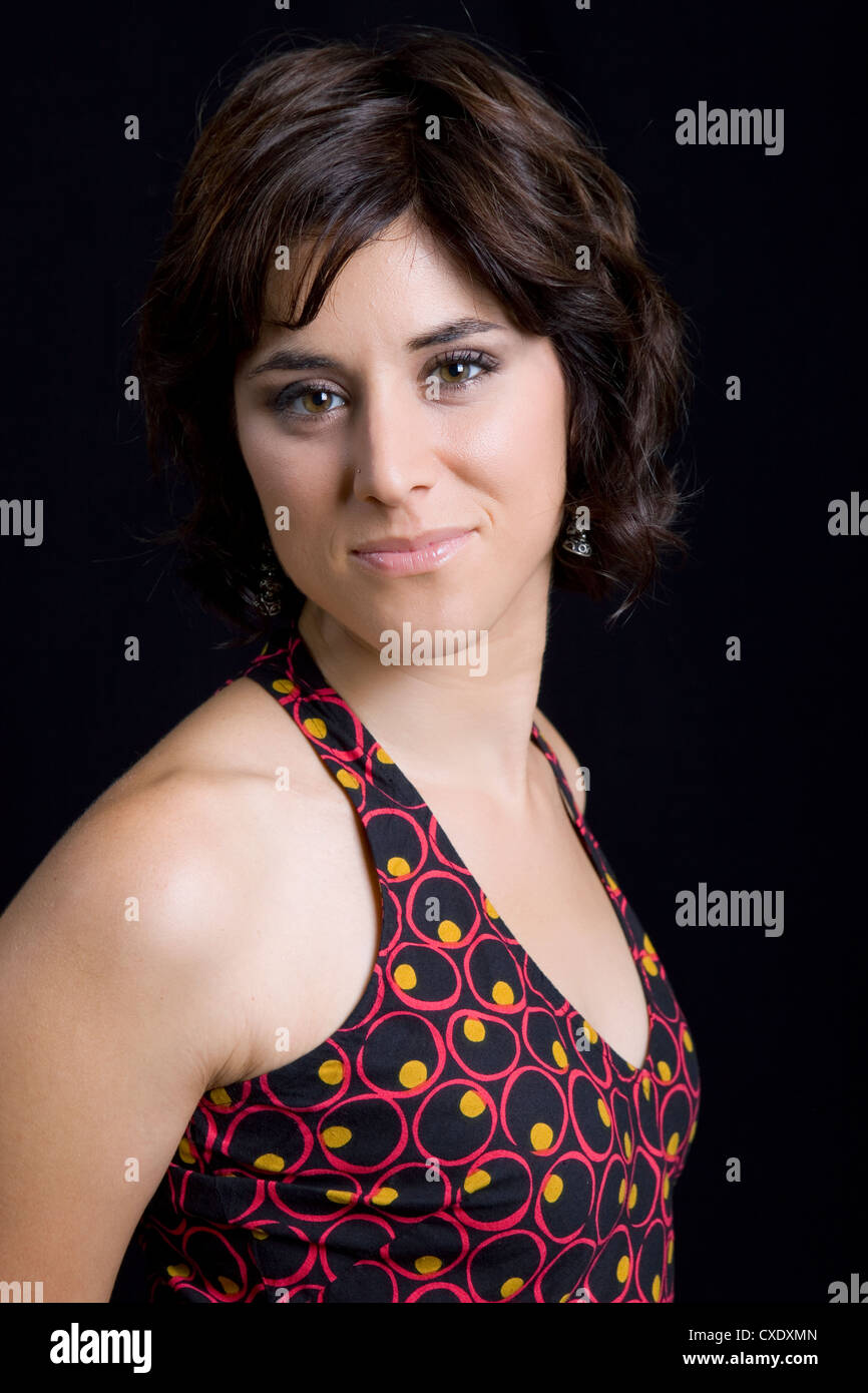 young beautiful brunette portrait against black background Stock Photo ...