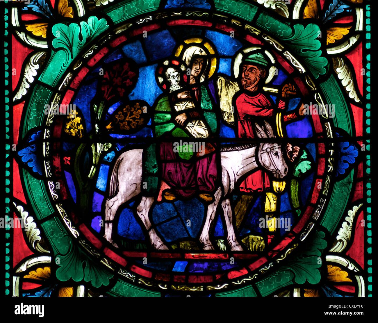 Medieval stained glass depicting Mary, baby Jesus and Joseph on a donkey, Canterbury Cathedral, Canterbury, Kent Stock Photo