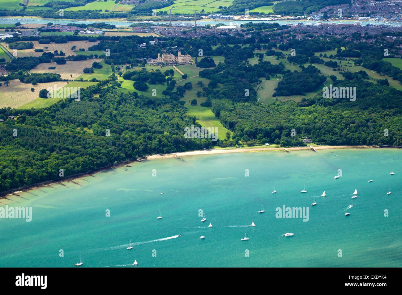 Aerial view of yachts racing in Cowes Week on the Solent, with Osborne House in background, Isle of Wight, England Stock Photo