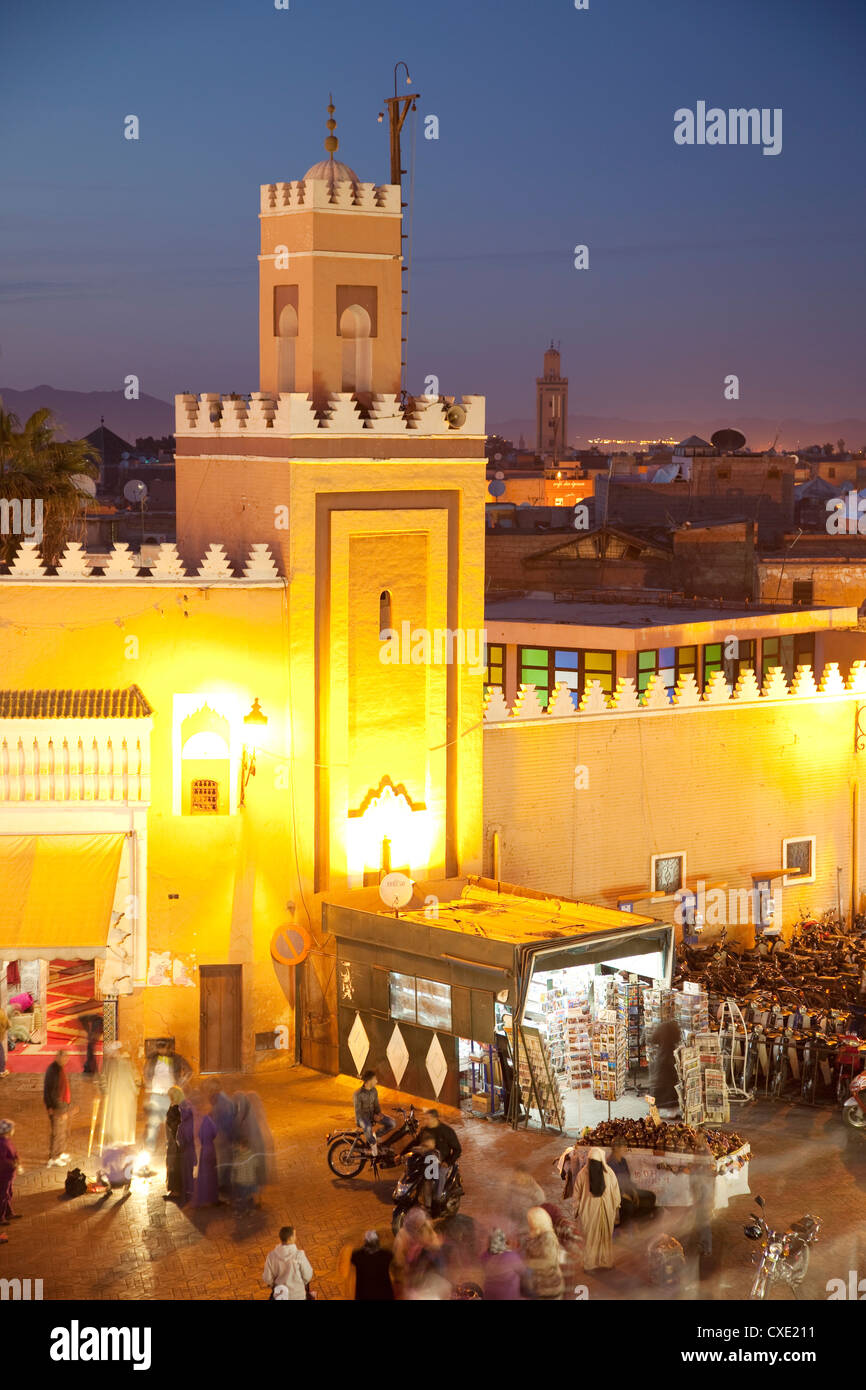 Mosque at dusk, Place Jemaa El Fna, Marrakesh, Morocco, North Africa, Africa Stock Photo