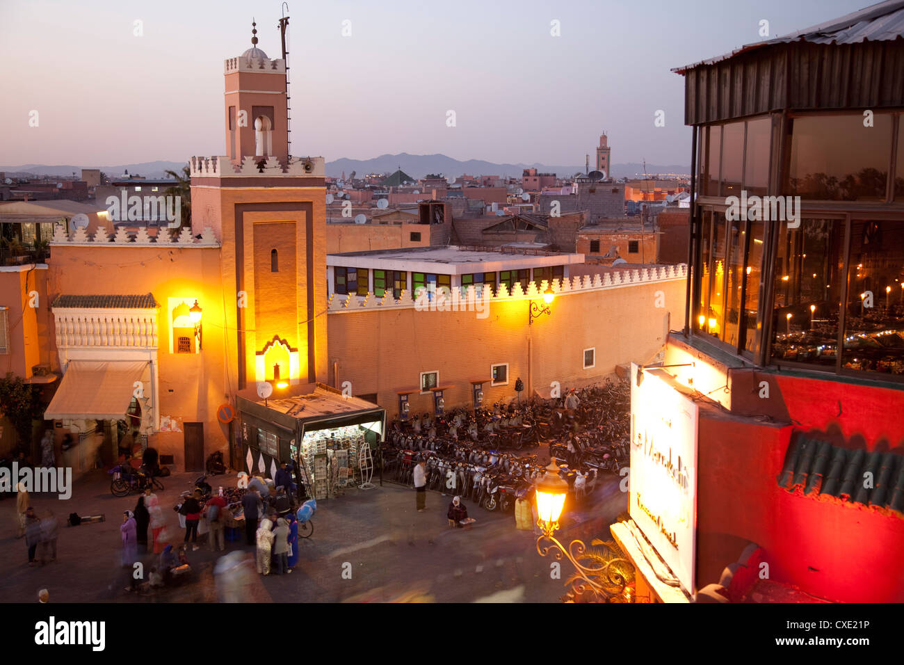 Mosque at dusk, Place Jemaa El Fna, Marrakesh, Morocco, North Africa, Africa Stock Photo