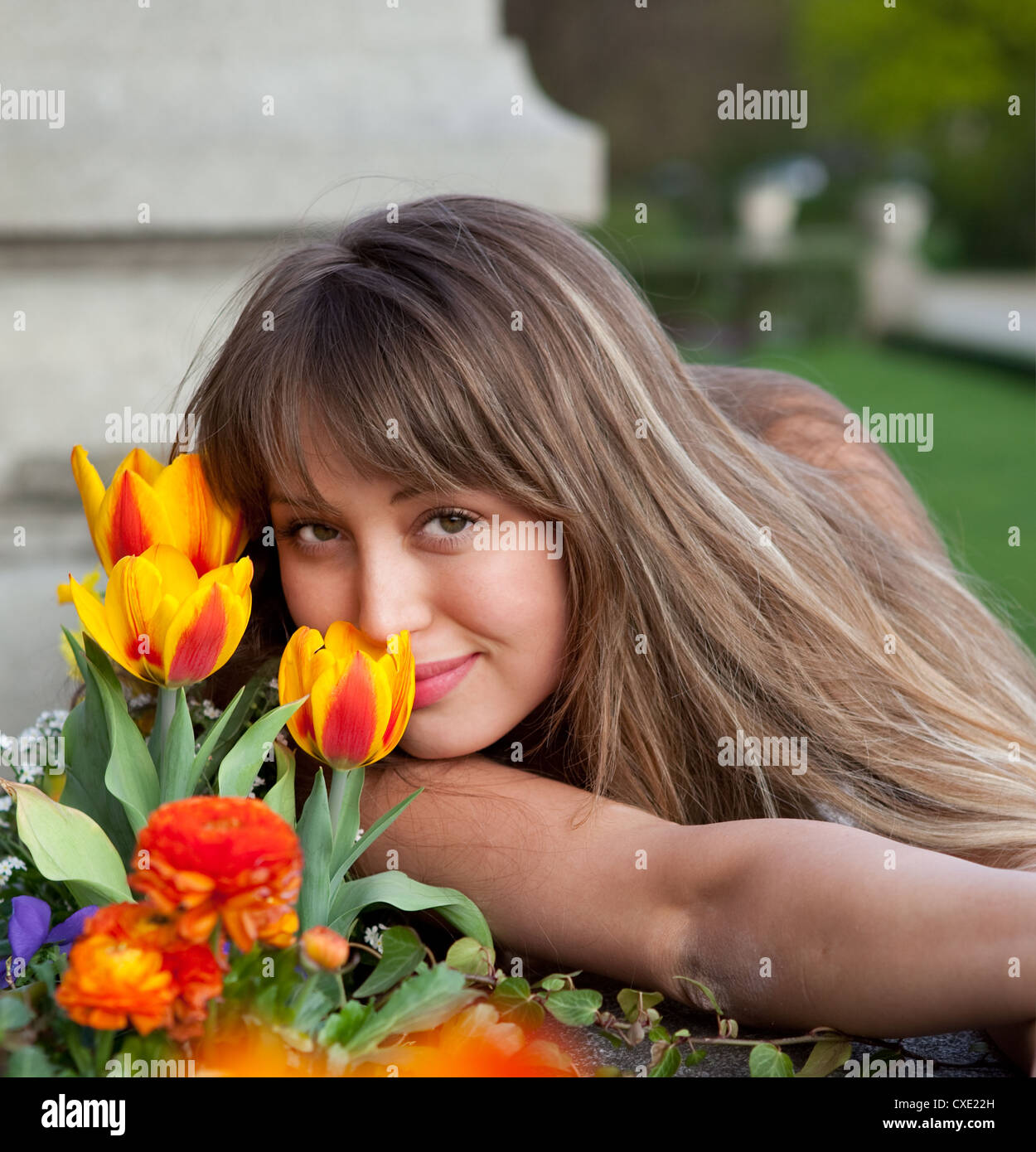 beautiful spring portrait with tulips Stock Photo - Alamy