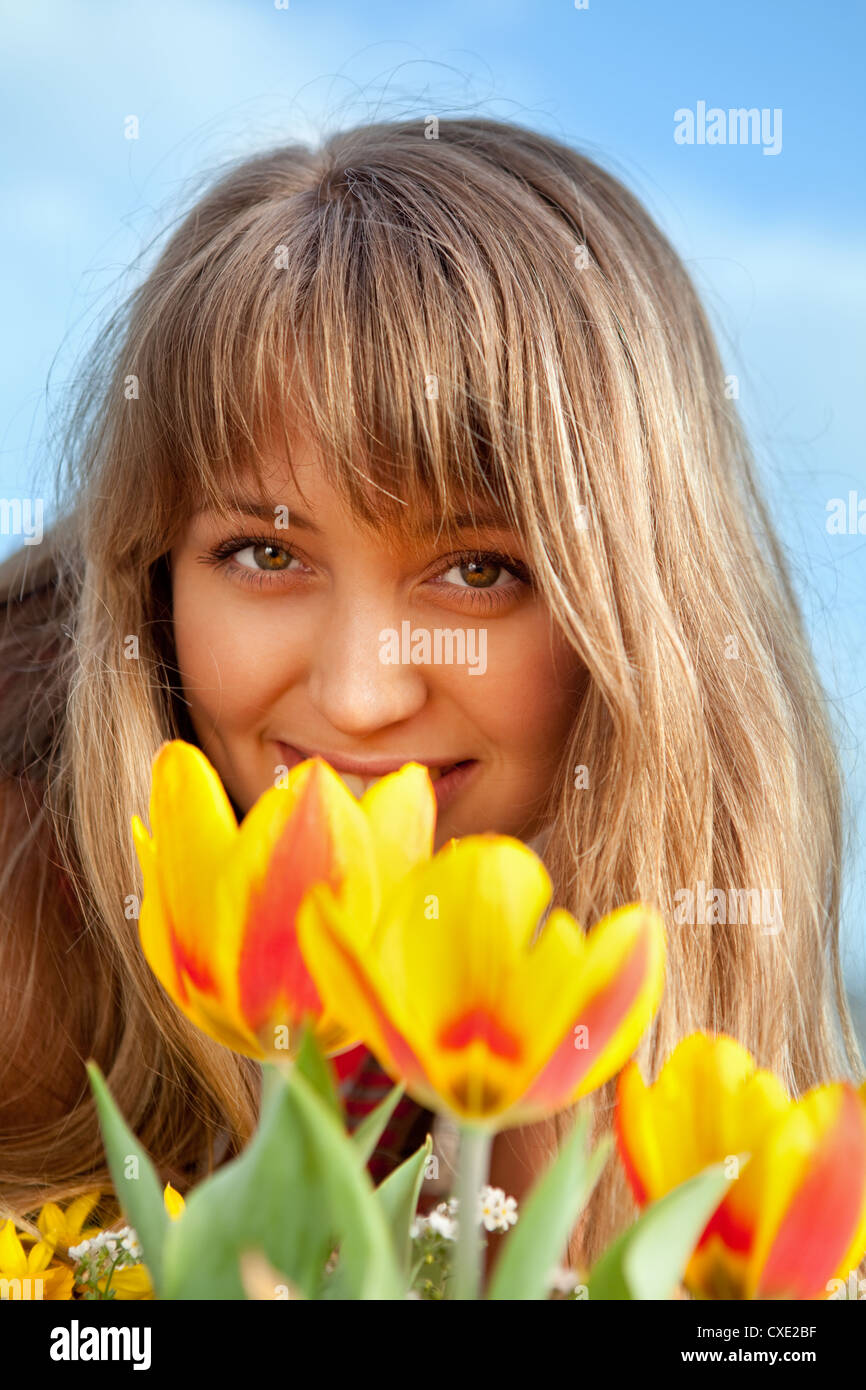 beautiful spring portrait with tulips Stock Photo - Alamy