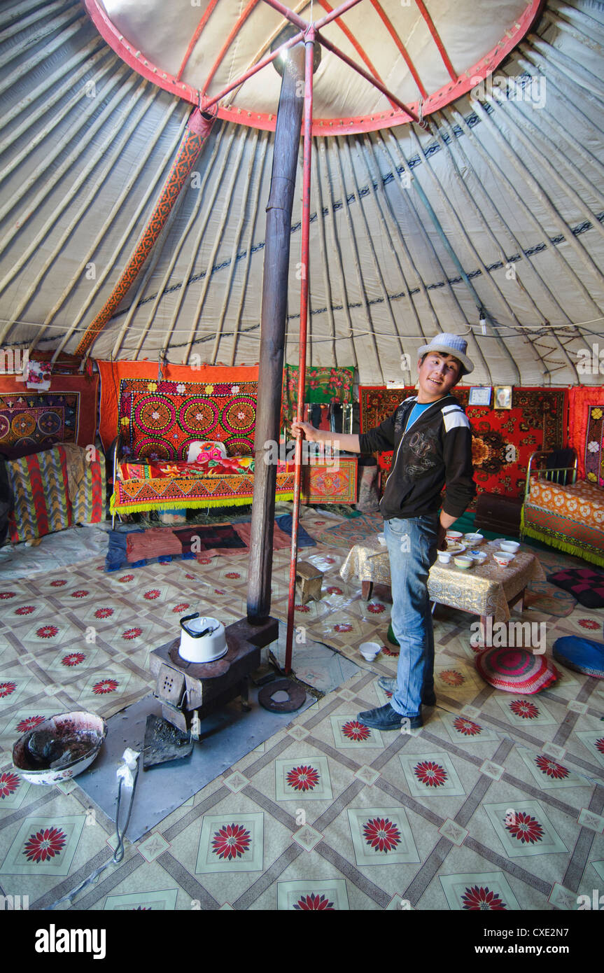 Kazakh teenager in a ger (yurt) in the Altai Region of Bayan-Ölgii in Western Mongolia Stock Photo