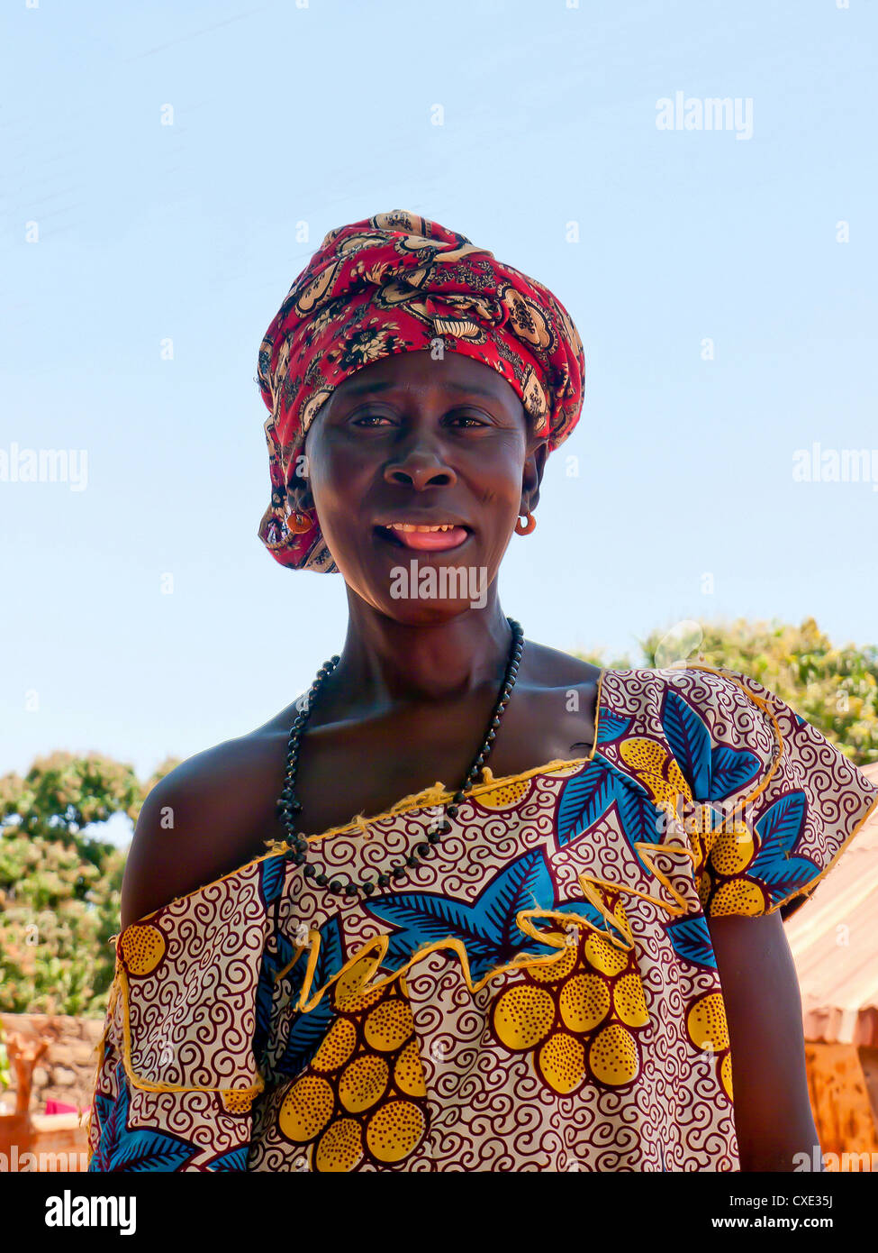 Colourful local lady in traditional costume the Island of Albreda, Gambia Stock Photo