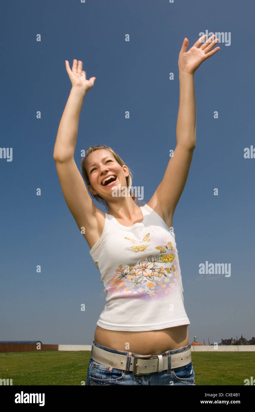 Berlin, young woman exults Stock Photo