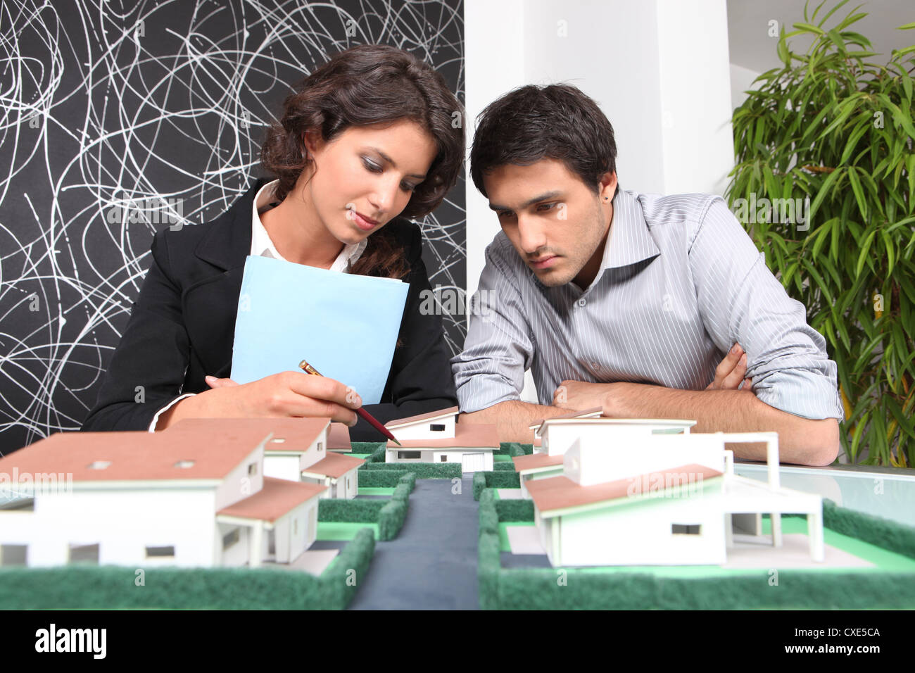 Testing Models Architectural Architects examining a model Stock Photo - Alamy