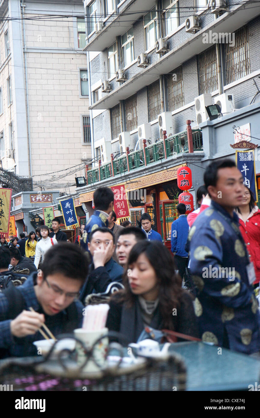 Beijing, Chinese eat in a local street Stock Photo