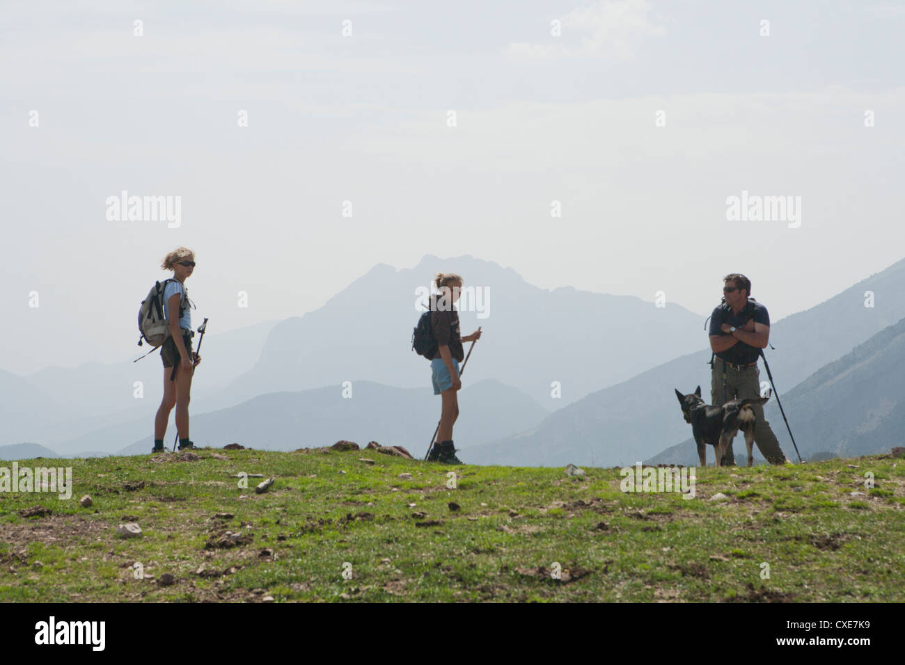 Family hiking on mountain Stock Photo - Alamy