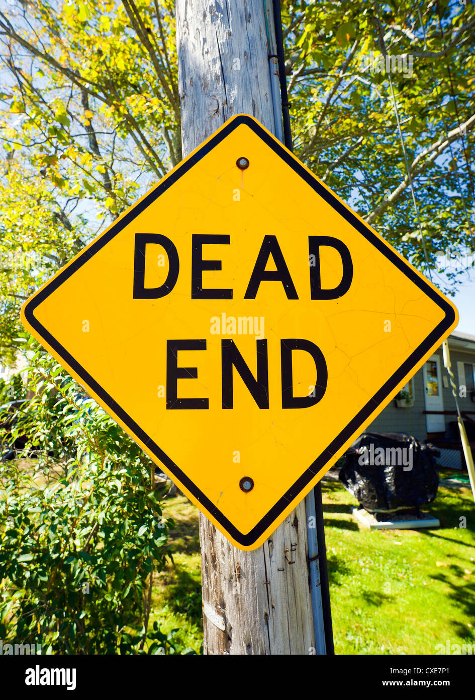 Dead end sign on wooden utility pole. Stock Photo