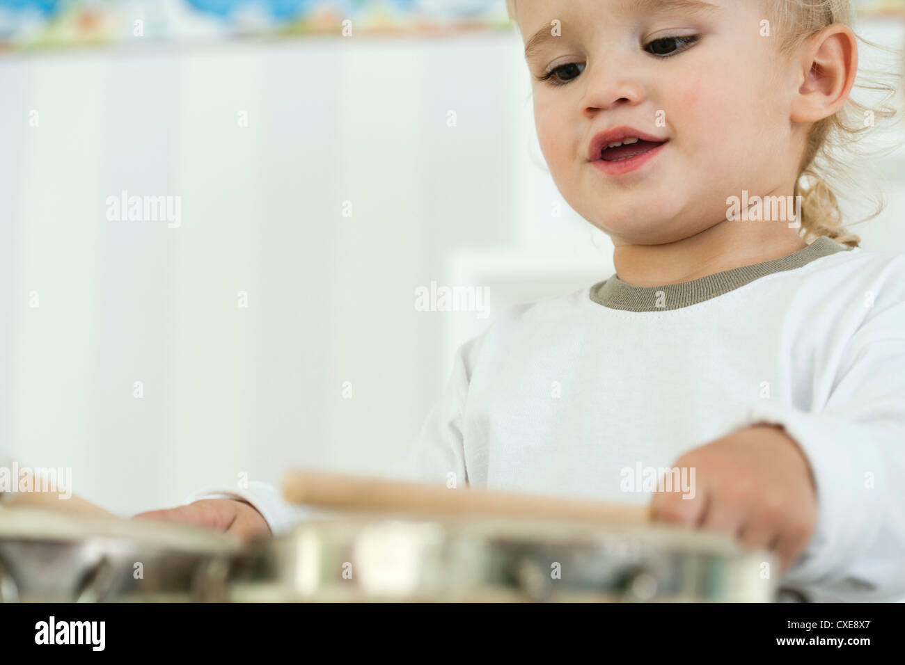 Baby boy playing drums, low angle view Stock Photo