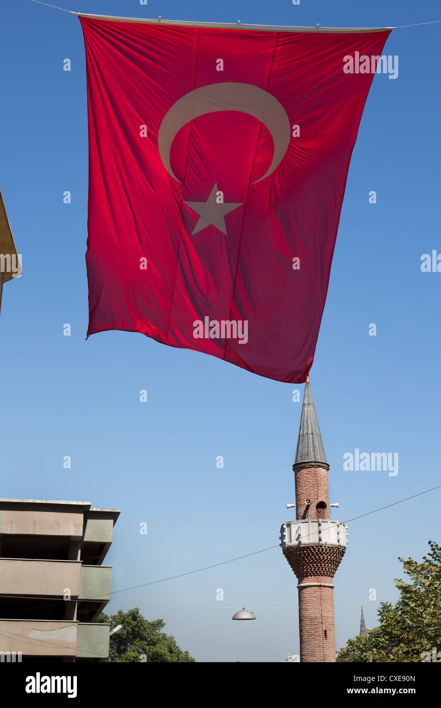 Minaret and Turkish flag in Istanbul, in Turkey Stock Photo