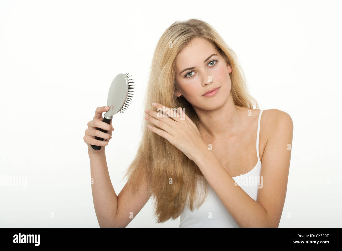 Teenage girl brushing her hair Stock Photo Alamy