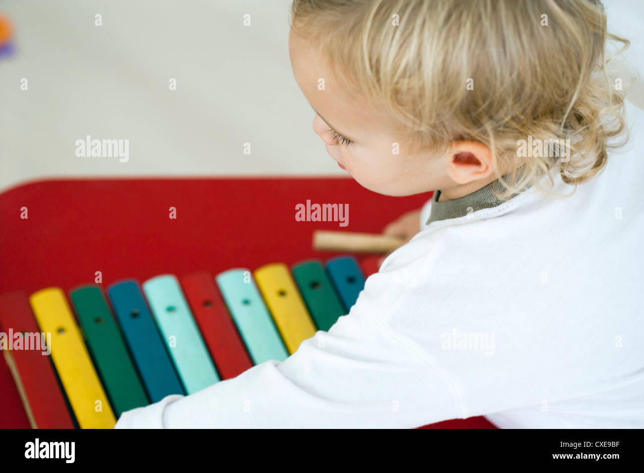 Baby boy with toy xylophone, high angle view Stock Photo