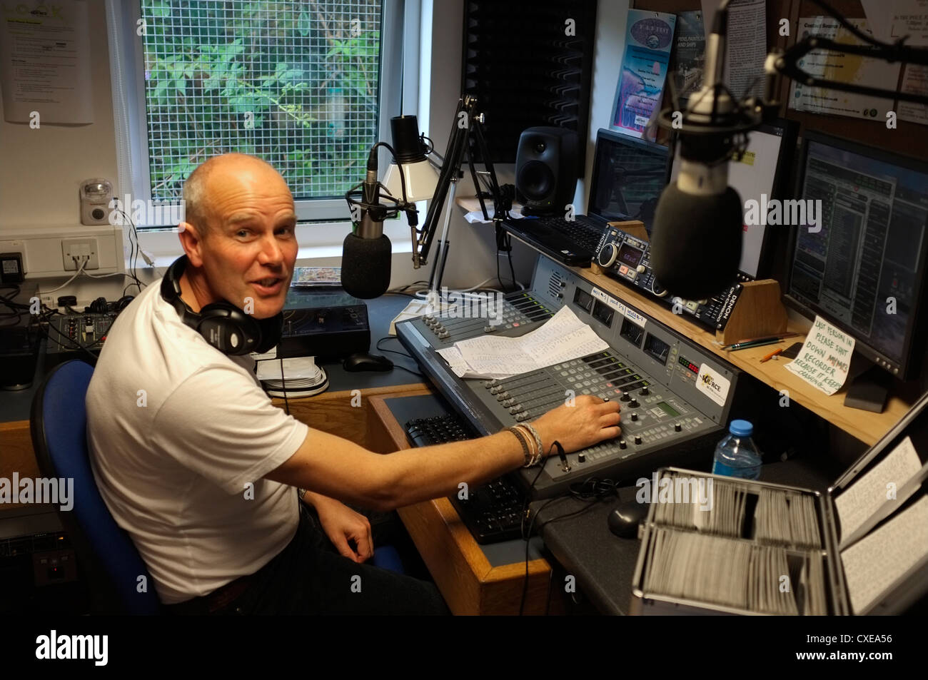 An amateur DJ broadcasting on local radio in Falmouth, Cornwall.  The Station is The Source 96.1 FM Stock Photo