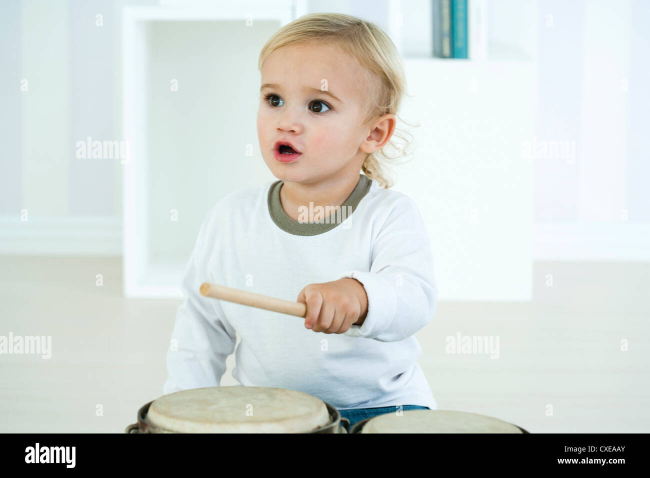 Baby boy playing drums Stock Photo
