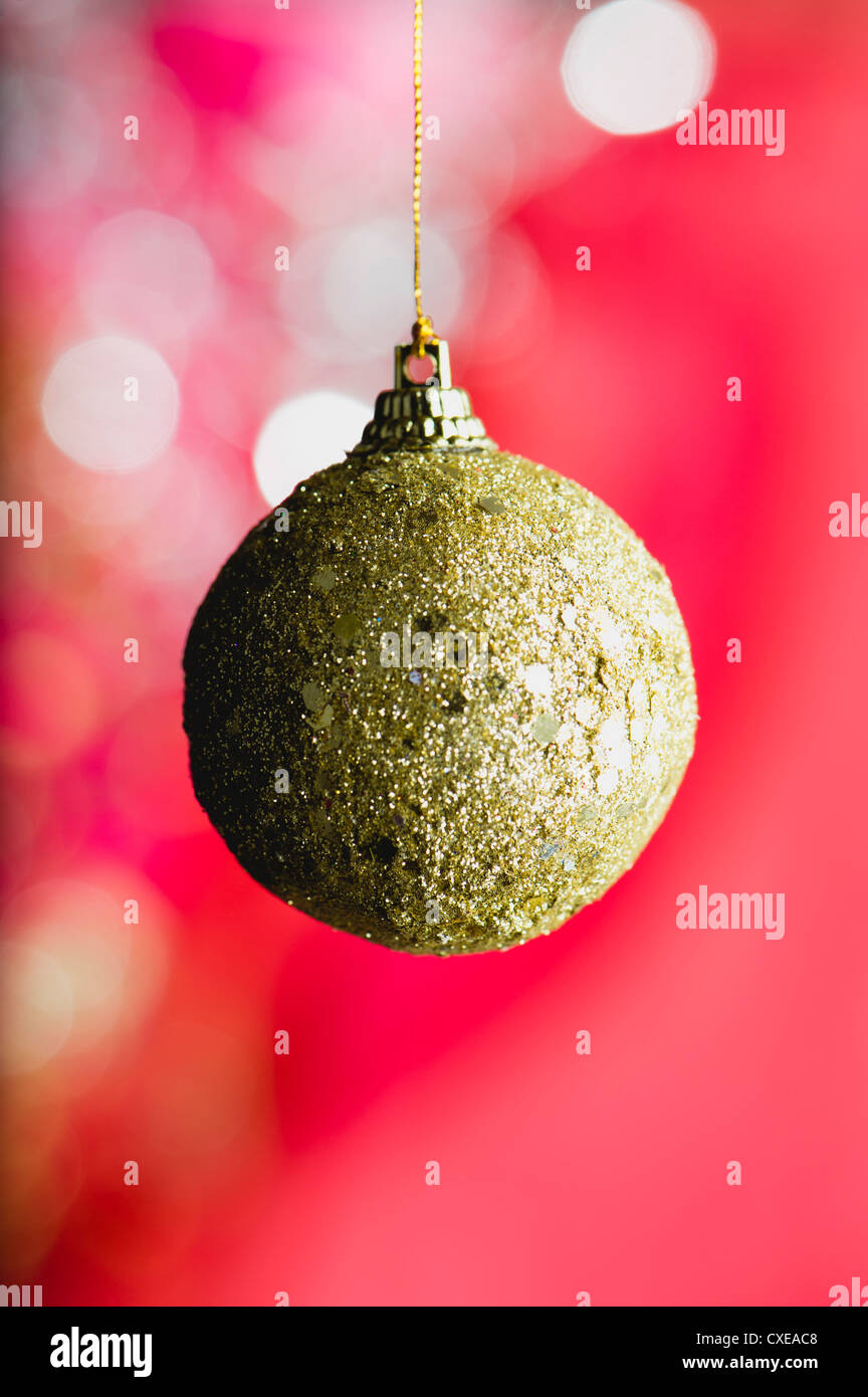 Glittered golden Christmas bauble Stock Photo