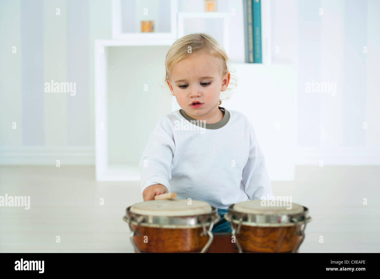 Baby boy playing drums Stock Photo Alamy