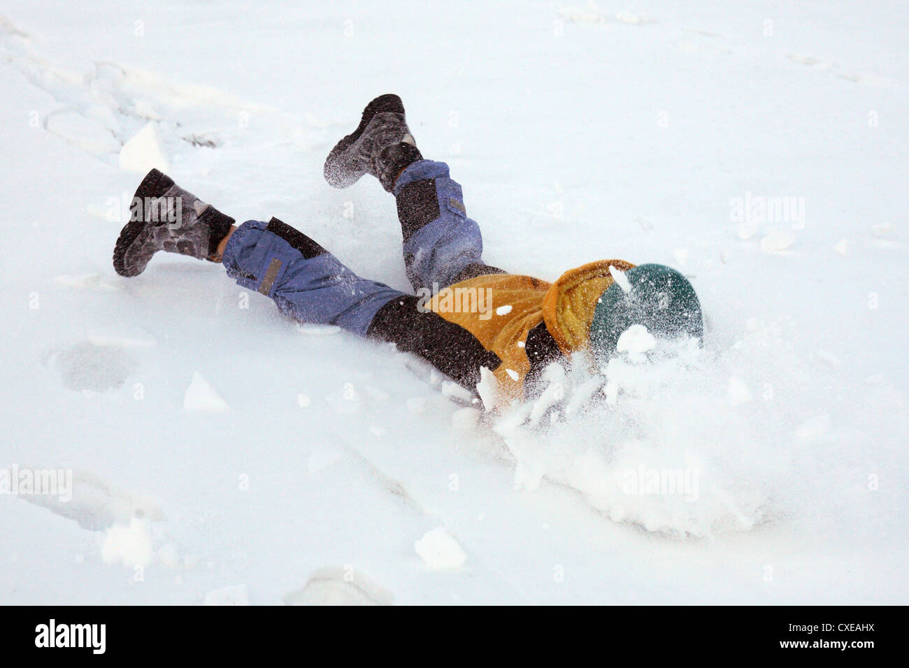 Tyrol, a child is raging in the snow Stock Photo