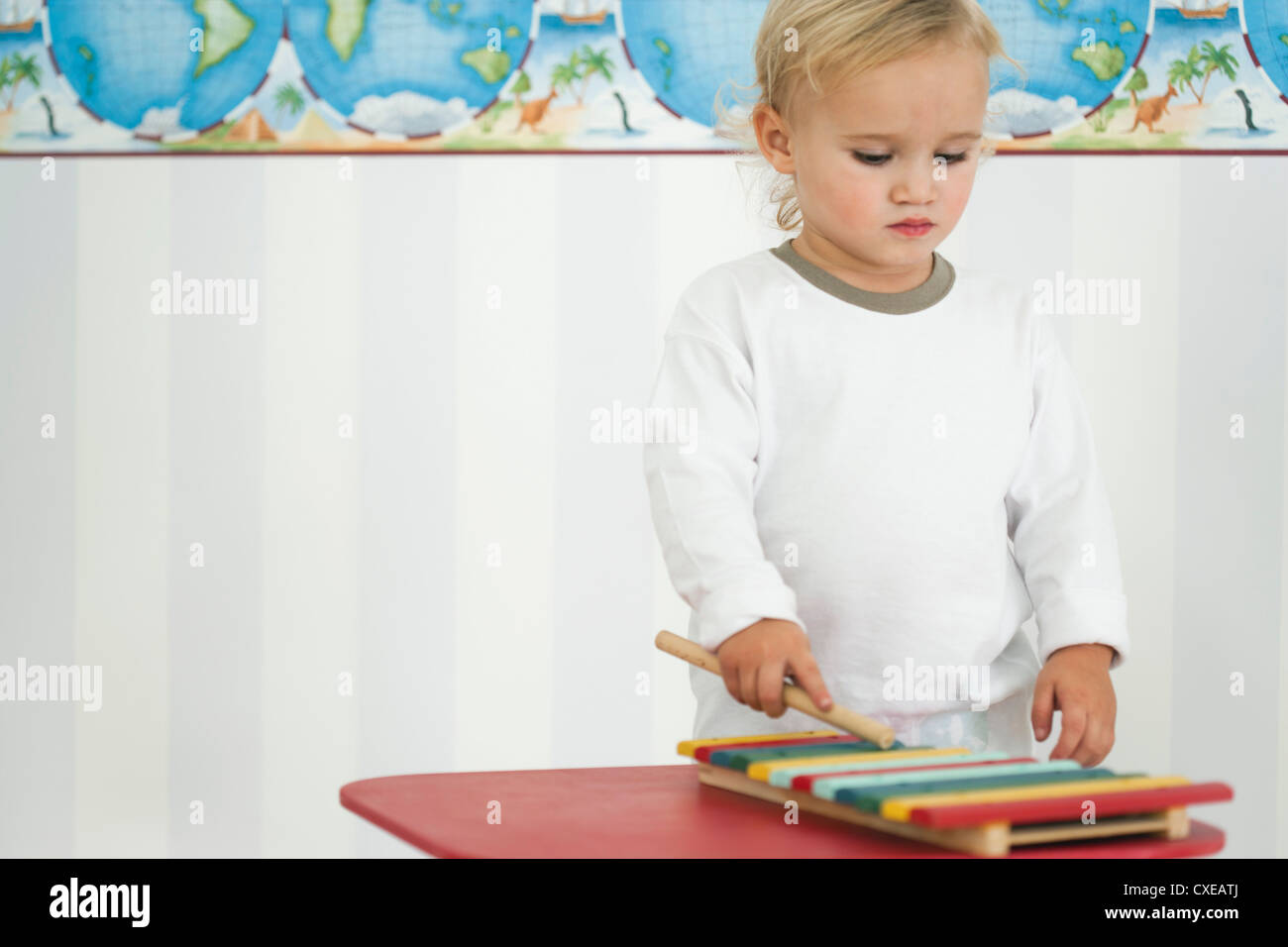 Baby boy playing toy xylophone Stock Photo