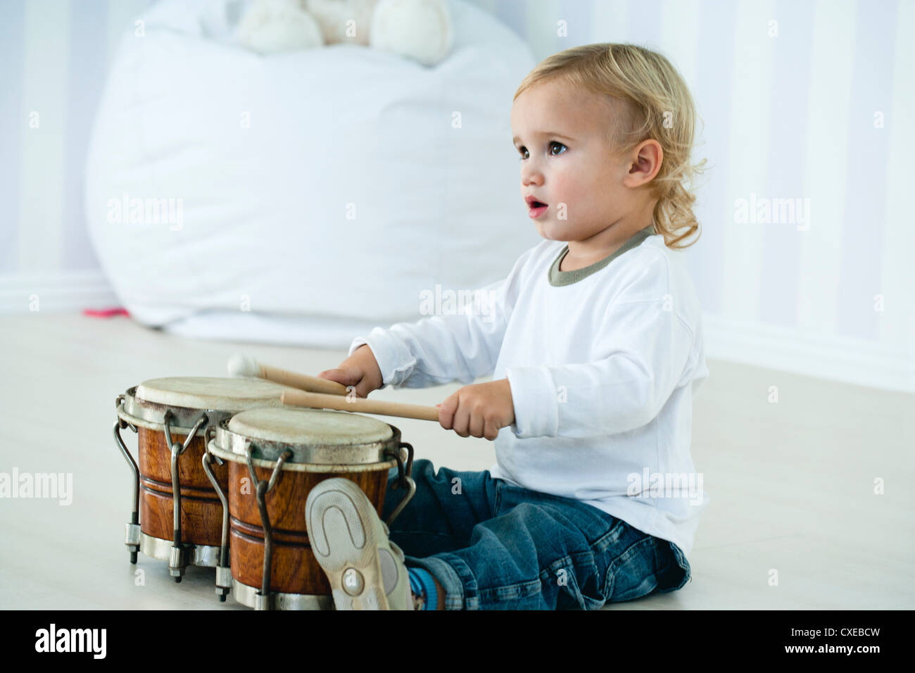 Baby boy playing drums Stock Photo Alamy