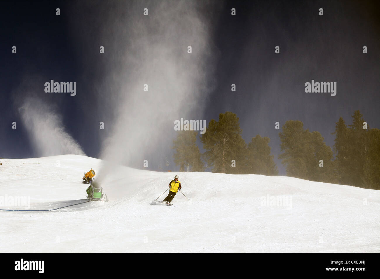 Tyrol, snow cannons to exude artificial snow on a ski slope Stock Photo