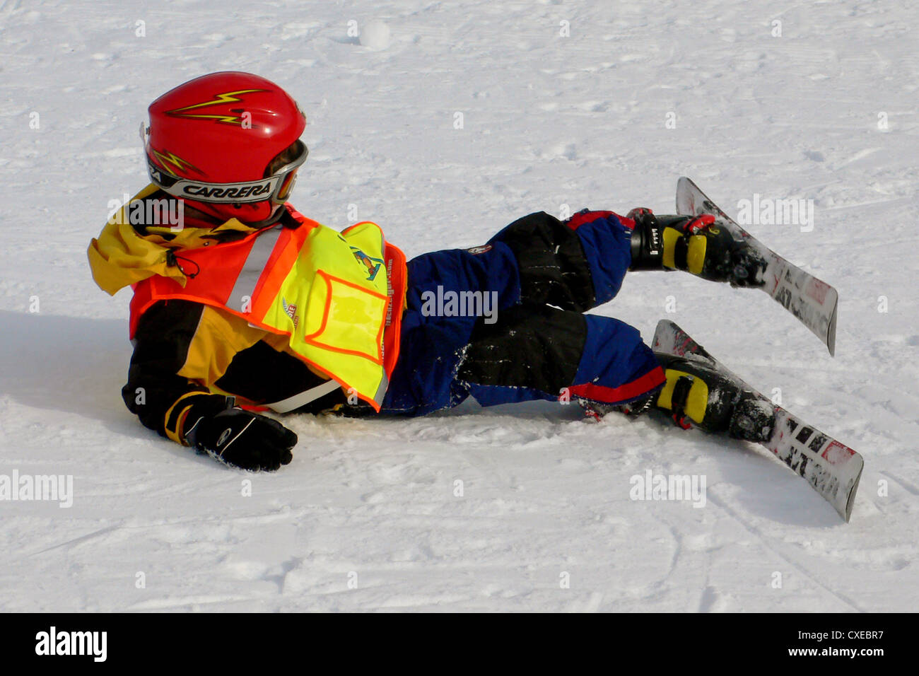 Tyrol, a child has fallen while skiing Stock Photo