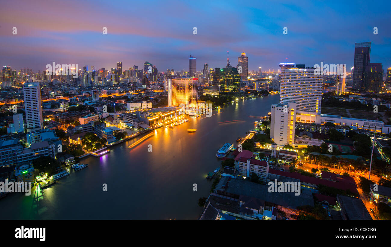 Night shot of Bangkok city along the Chao Phraya river Stock Photo