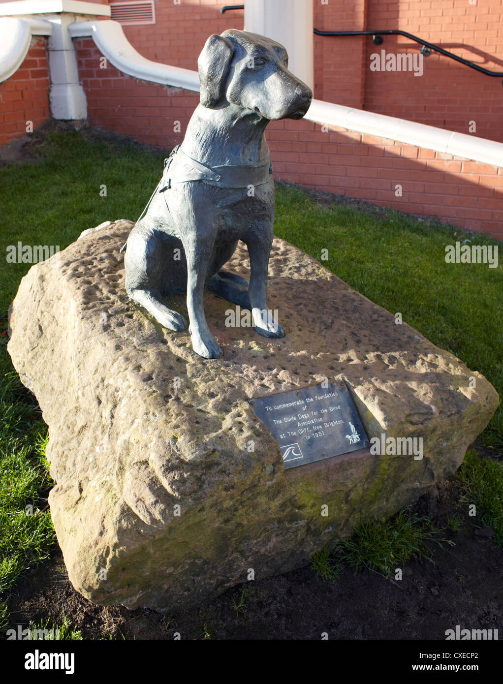 Statue of guide dog at New Brighton to commemorate the foundation of The Guide Dogs for the Blind Association in 1931 Stock Photo