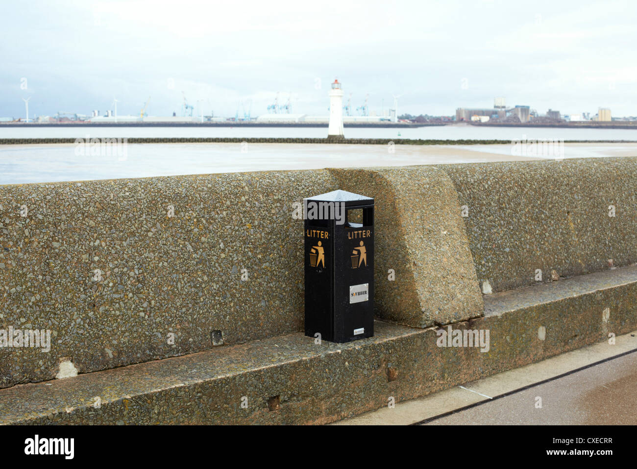 Litter bin and seawall at New Brighton, Liverpool, UK Stock Photo