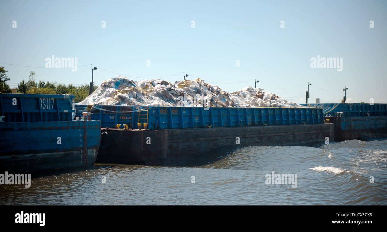 Barges with recyclable trash docked in the Fresh Kills landfill in