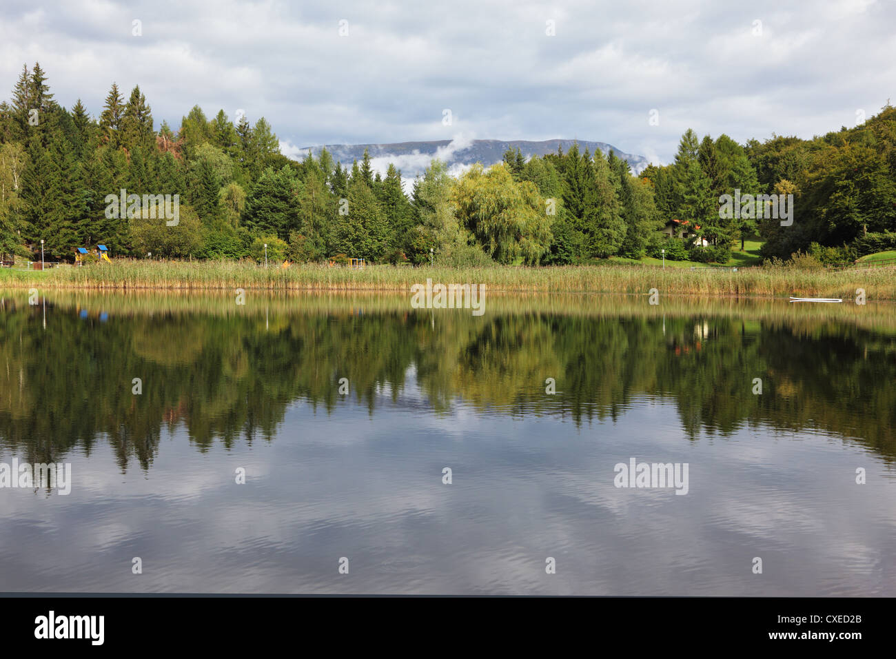 Cloudy sky reflected in water hi-res stock photography and images - Alamy