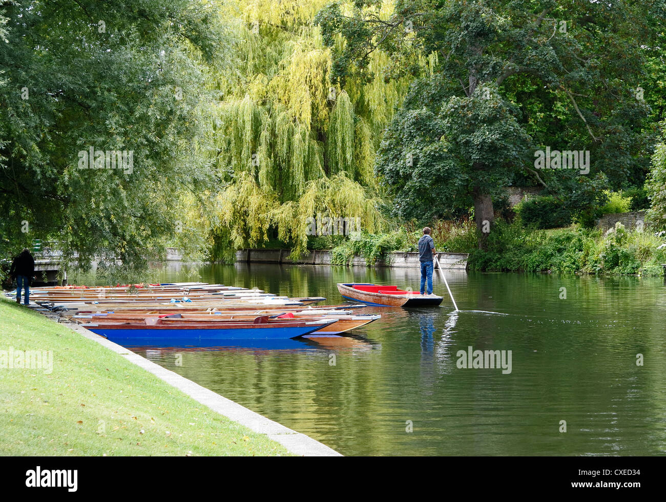 Punts on river Cam Cambridge waiting customers and one going to collect passengers Stock Photo