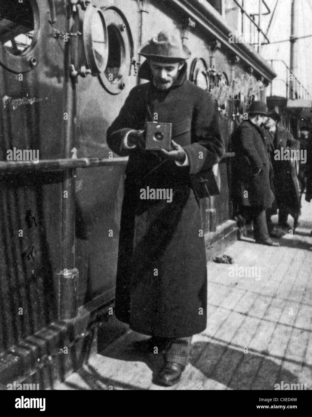 GEORGE EASTMAN (1854-1932) American inventor of roll film and founder of the Eastman Kodak Company holding a box camera in 1890 Stock Photo