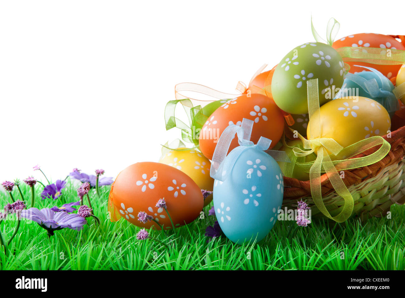 color easter eggs in basket isolated on white Stock Photo - Alamy
