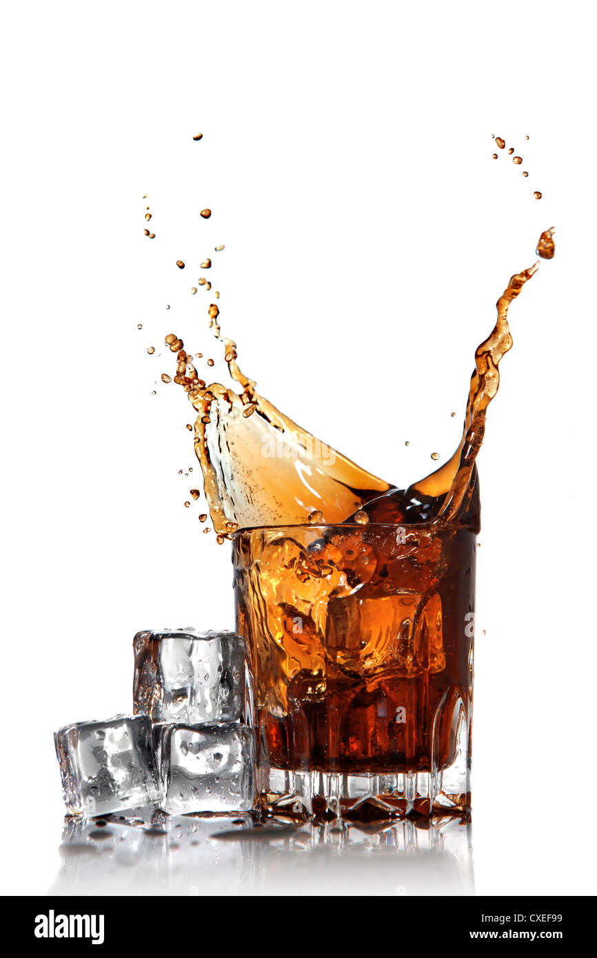 splash of cola in glass with ice cubes isolated on white Stock Photo ...