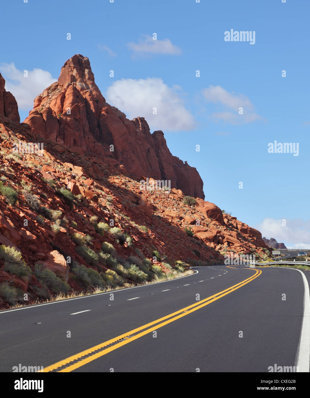 The marked road passes between rocks Stock Photo - Alamy