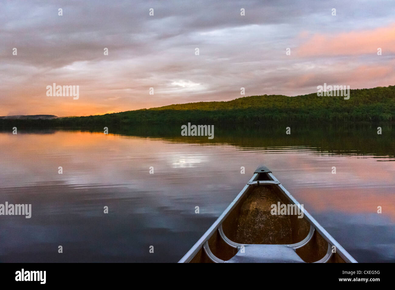 Canoeing on lake at sunset at the Killarney Lodge resort, Lake of Two